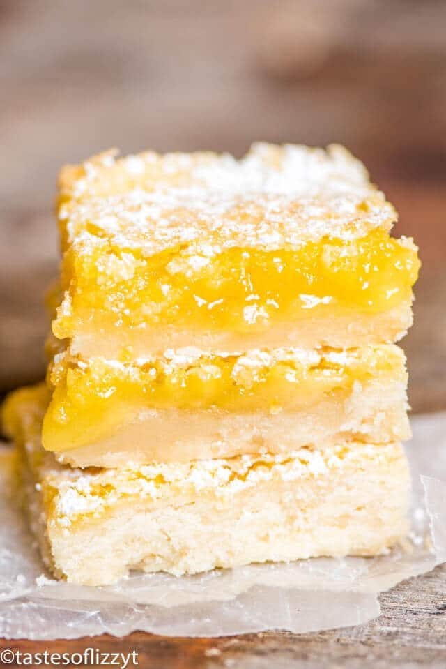 A close up of a stack of lemon bars