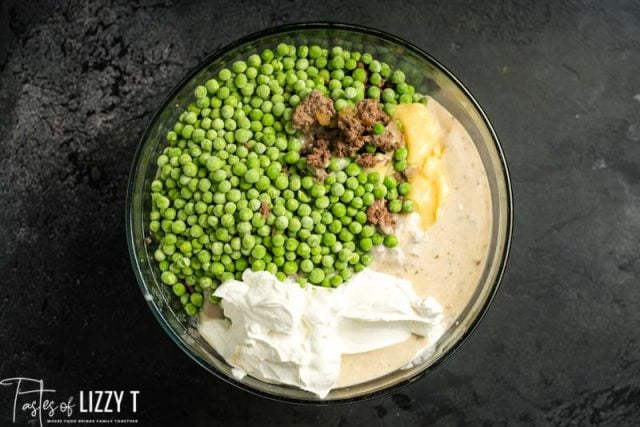 peas, beef and sour cream in a mixing bowl