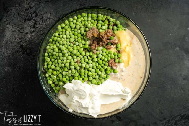 peas, beef and sour cream in a mixing bowl