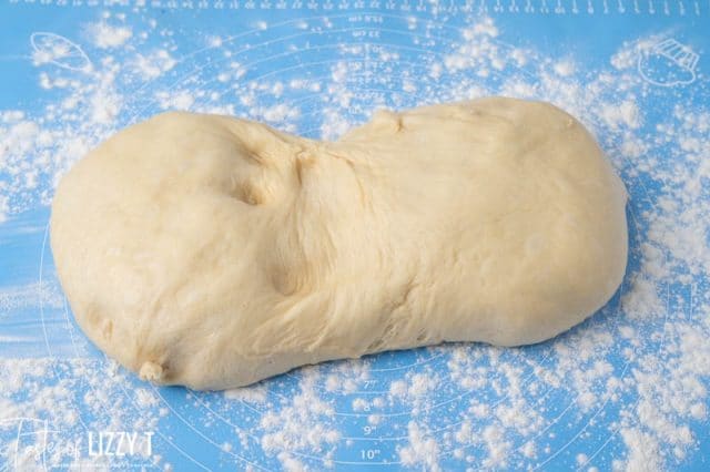 sweet roll dough on a baking mat