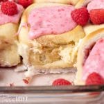 sweet rolls with raspberry in a baking pan
