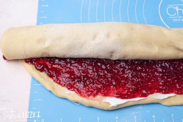 raspberry filled dough rolled as a sweet roll