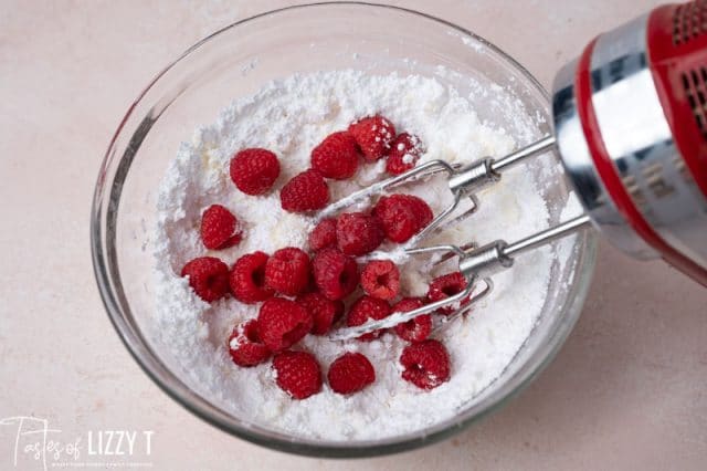 raspberries in powdered sugar in a mixing bowl