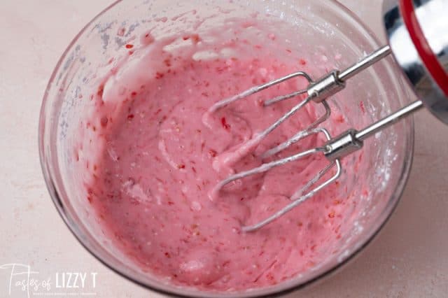 raspberry frosting in a mixing bowl