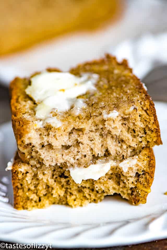 buttered banana bread on a plate