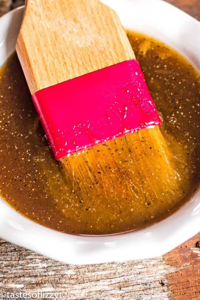 easy honey ham glaze recipe with a pastry brush in it