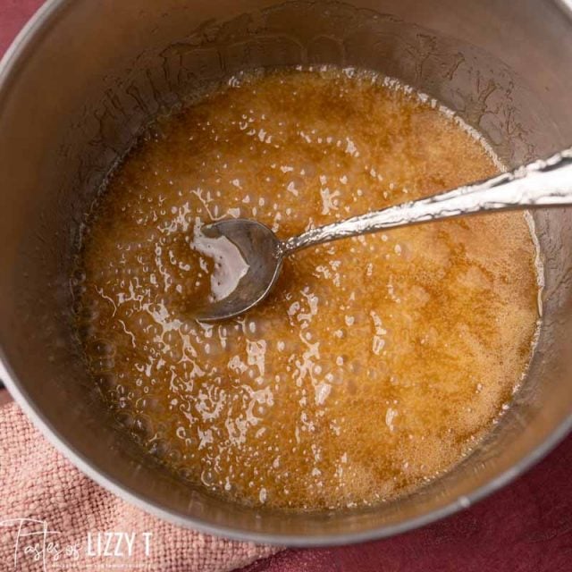 caramel sauce in a pan with a spoon