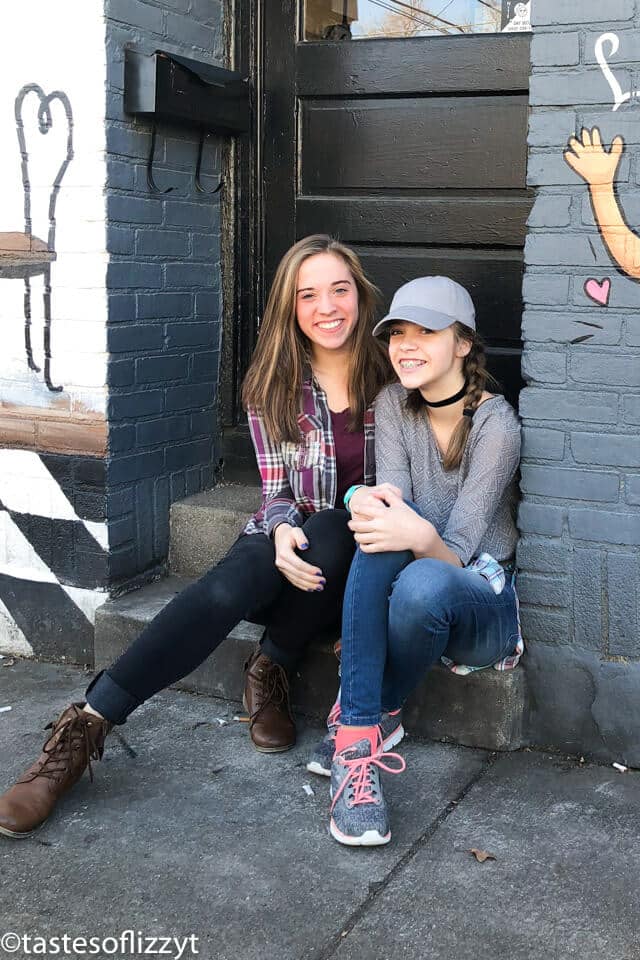 sisters sitting on cement steps