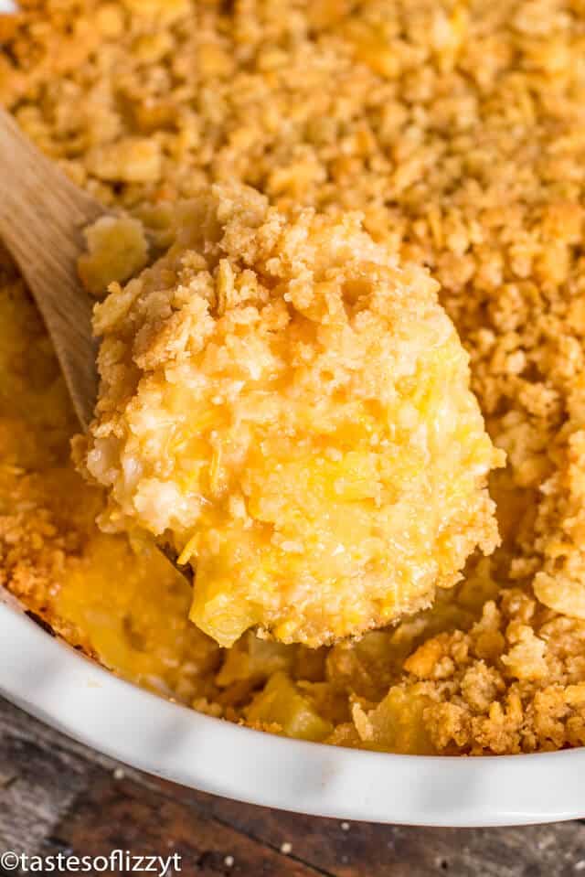 easy baked pineapple on a wooden spoon