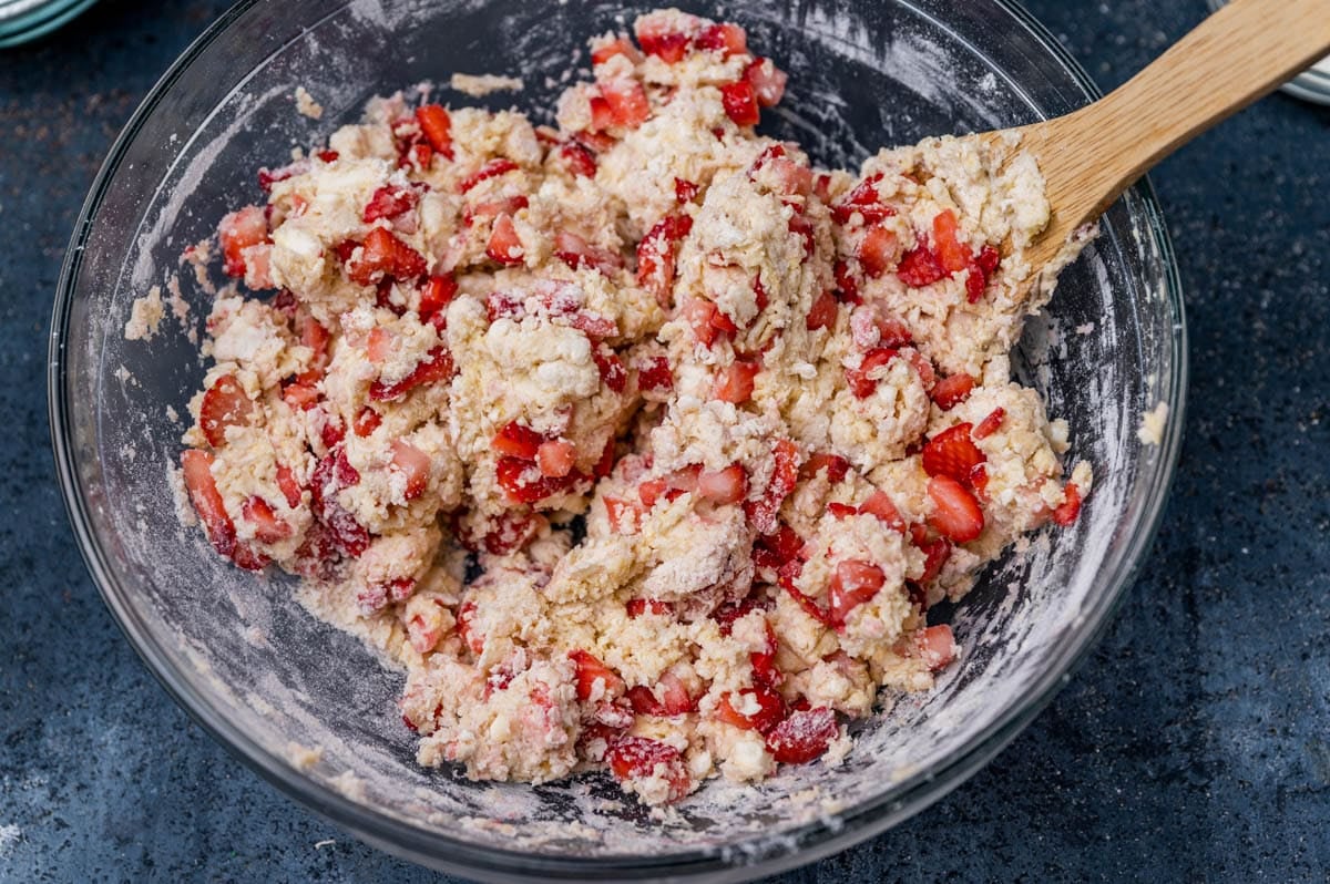 scone dough in a bowl with strawberries
