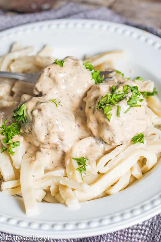 Authentic Swedish meatballs sauce ladled over Swedish meatballs