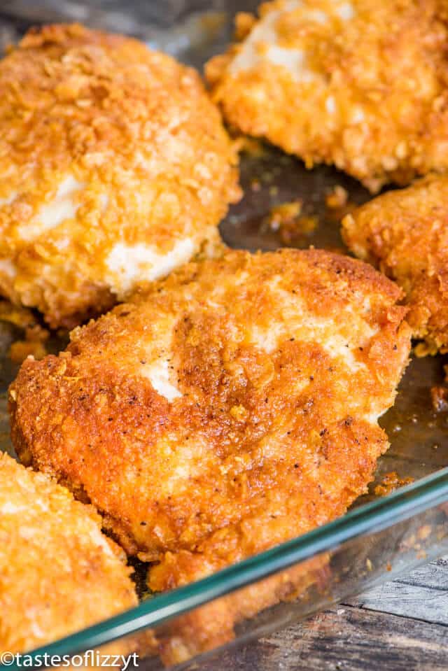 A close up of fried chicken in baking dish