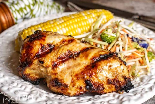 A plate of food, with mustard chicken