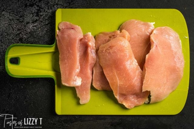 chicken breasts on a cutting board