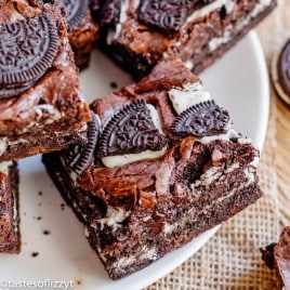 plate of chocolate brownies with oreos on top