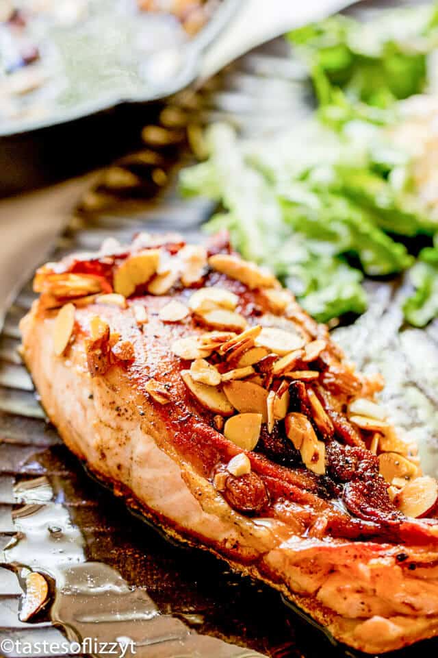 A close up of a plate of food, with Salmon and Almonds