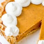 Homemade Pumpkin Pie with a slice removed