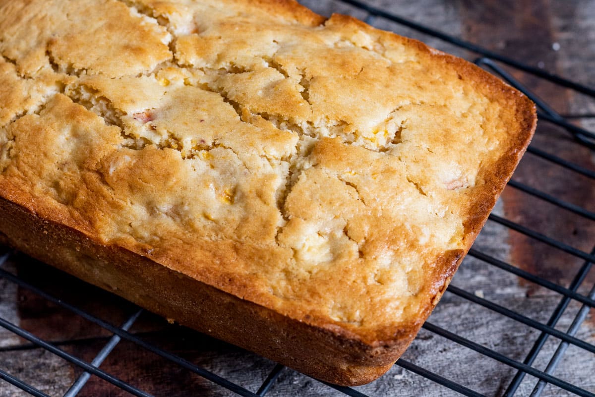 baked peach bread on a wire rack