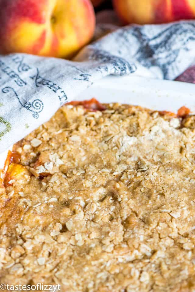 peach crisp with oatmeal topping in baking dish
