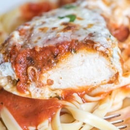 Breaded chicken breasts with spaghetti sauce and cheese