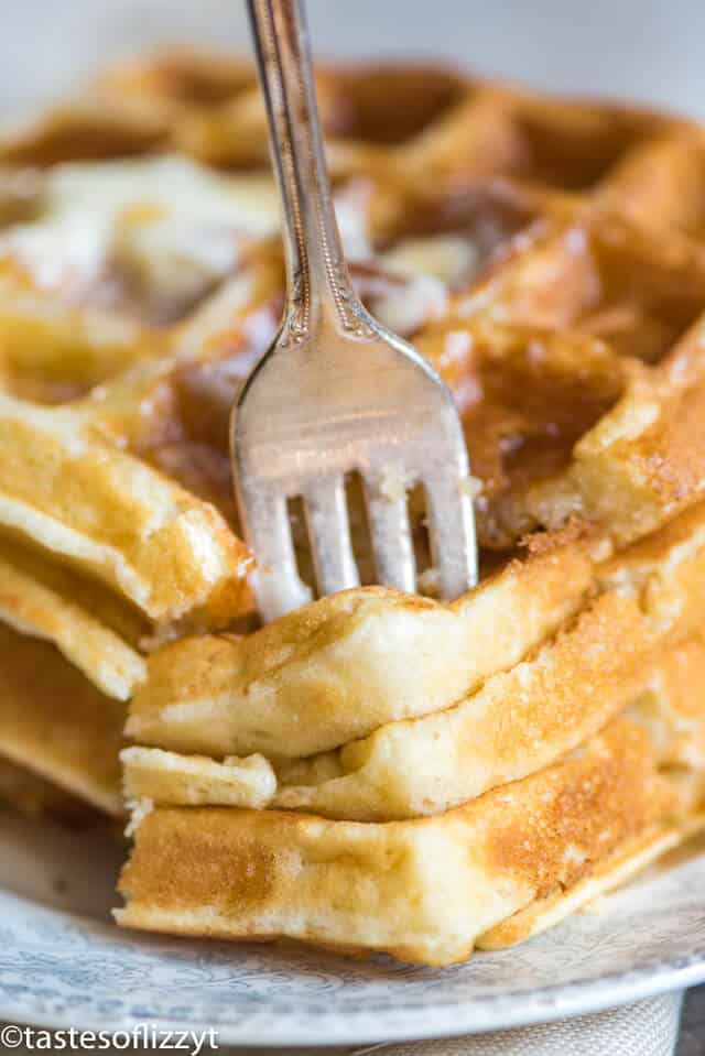 stack of belgian waffles with a fork