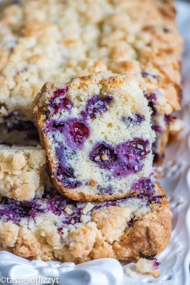 a piece of blueberry bread with streusel on top