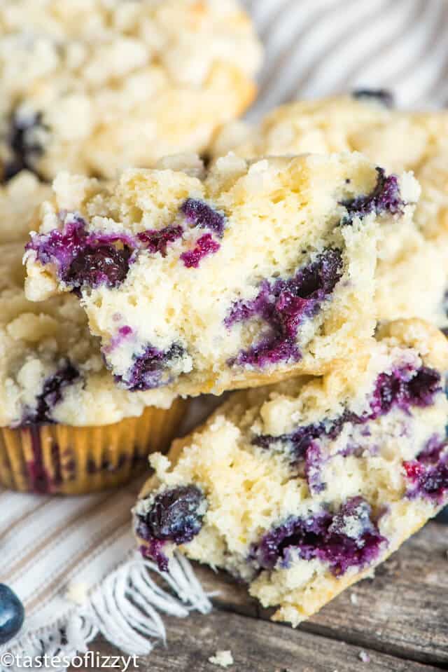 A close up of half of a blueberry muffin