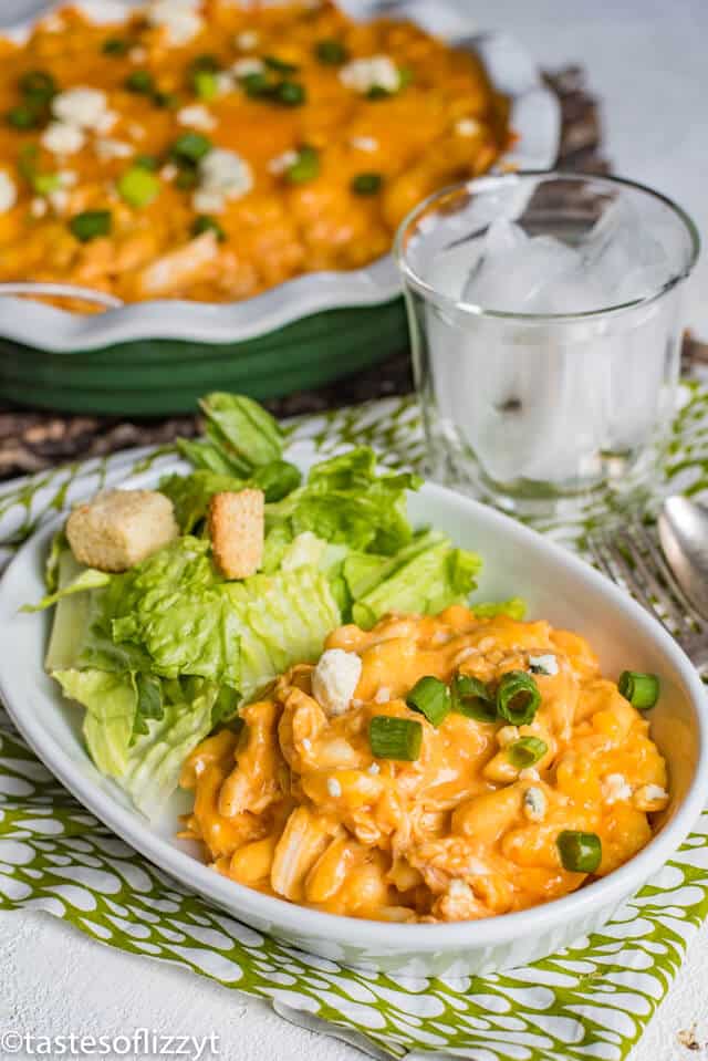 A plate of food on a table, with Cheese and Casserole