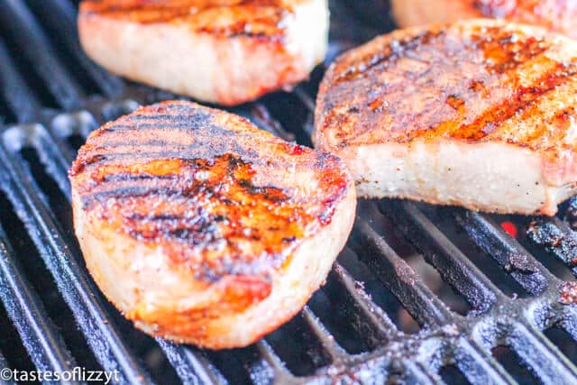 A close up of food on a grill, with Pork chop