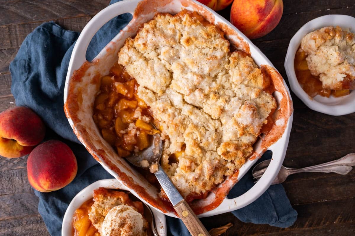 overhead view of peach cobbler on a table