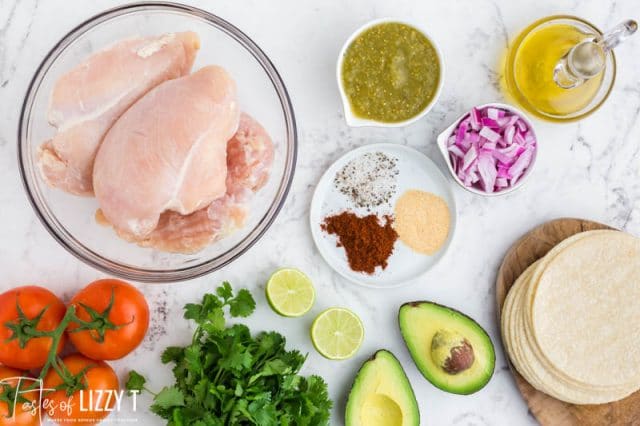 ingredients for salsa verde chicken tacos on a table