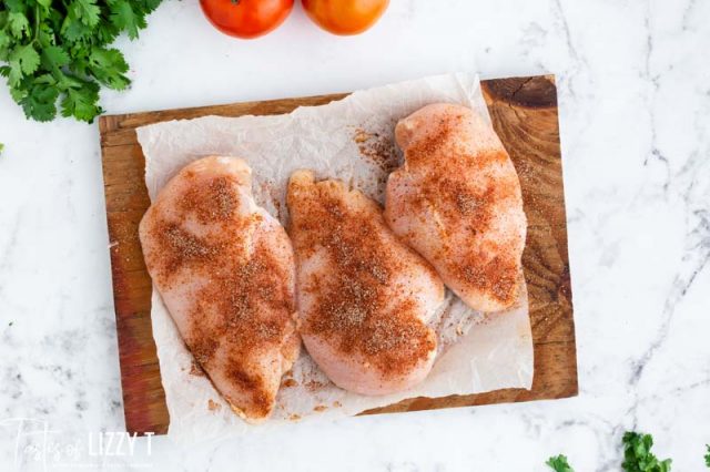 seasoned chicken on a cutting board