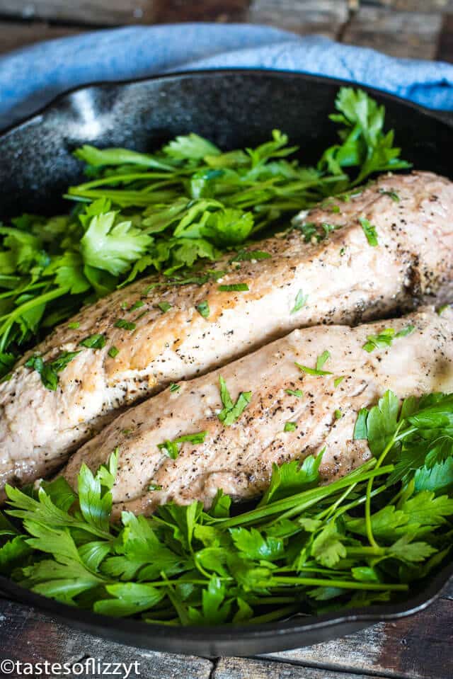 pork tenderloin in a skillet with parsley