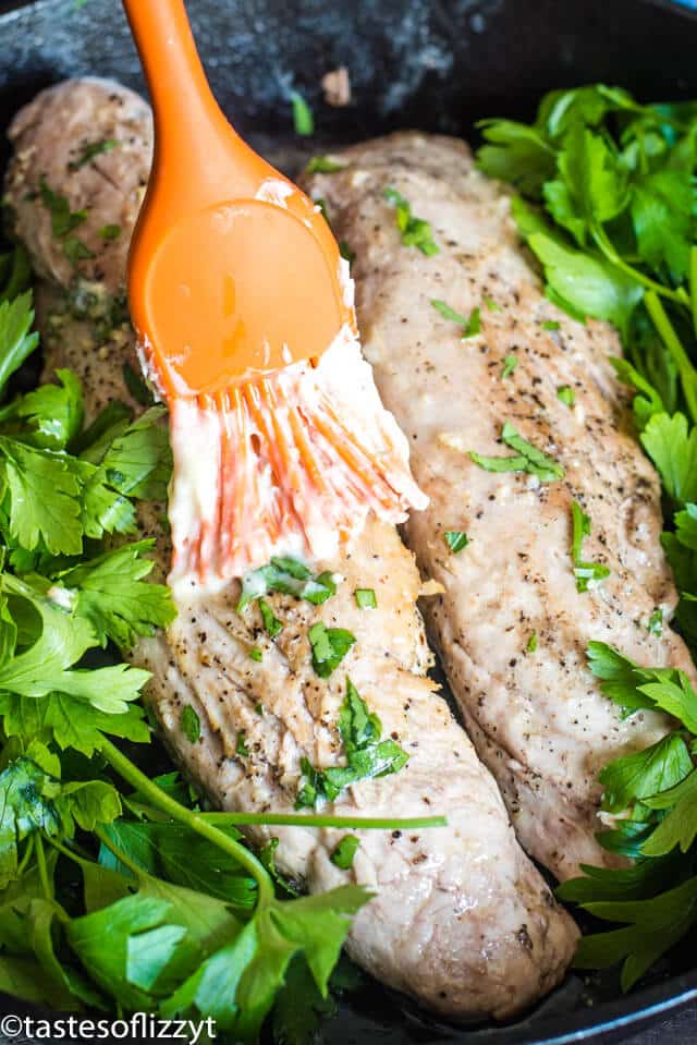 brushing butter on pork tenderloin