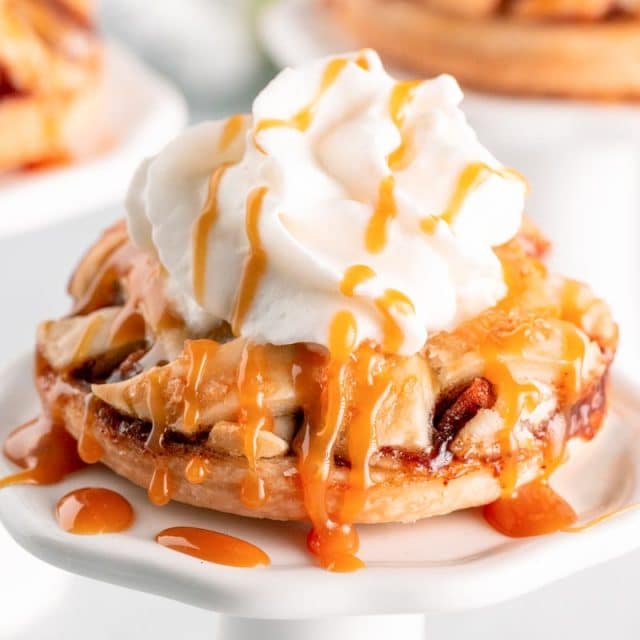 mini apple pie with ice cream and whipped cream