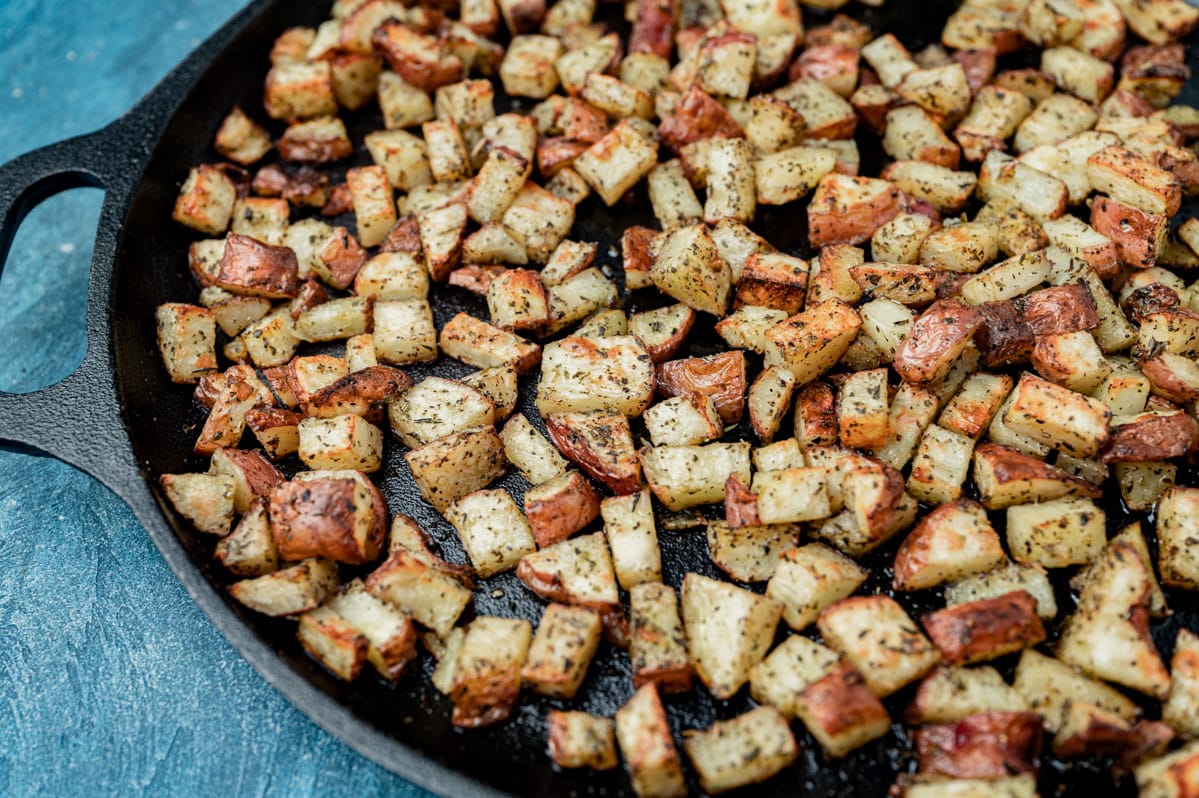 oven roasted potatoes on a cast iron skillet
