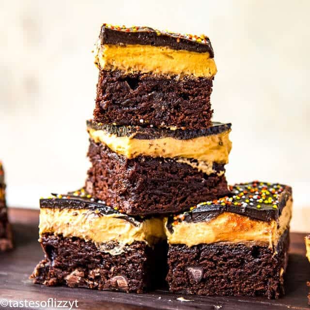 stack of chocolate brownies with pumpkin cheesecake