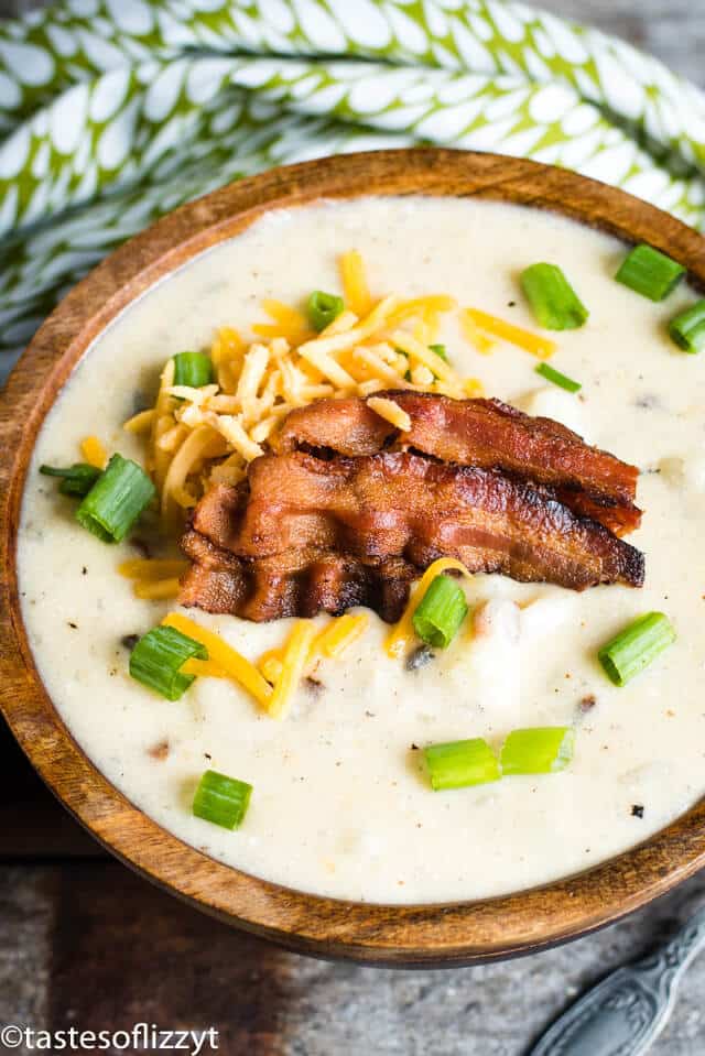 overhead view of bowl of potato soup with bacon and cheese