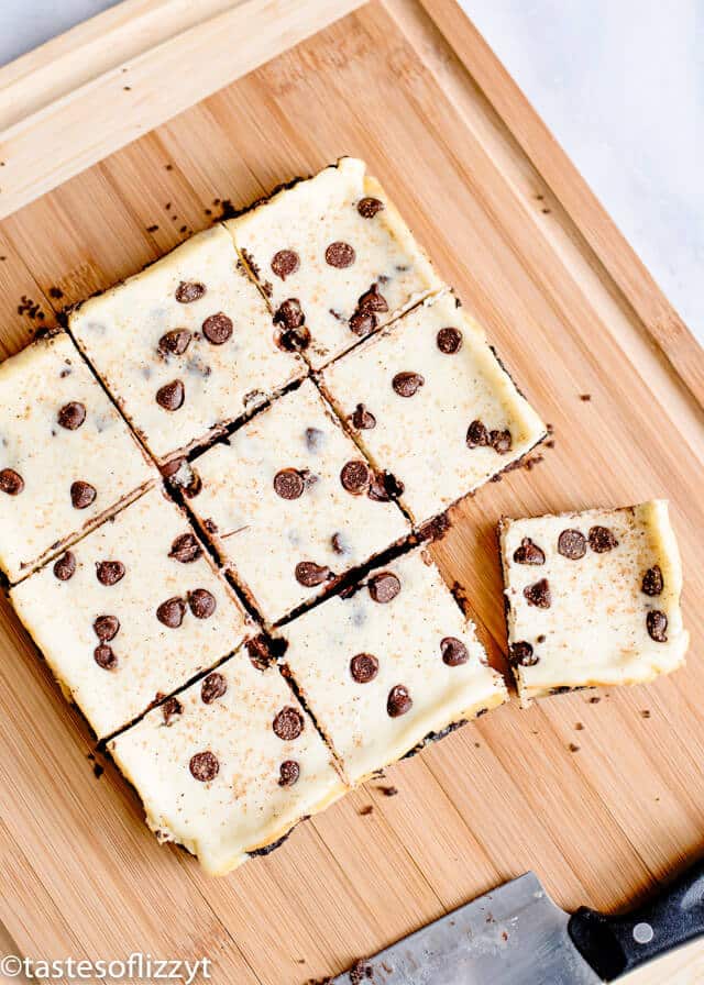 eggnog bars with chocolate chips on a cutting board