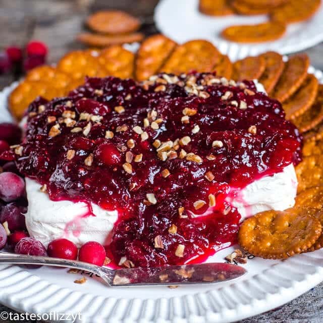 block of cream cheese with cranberry orange jam