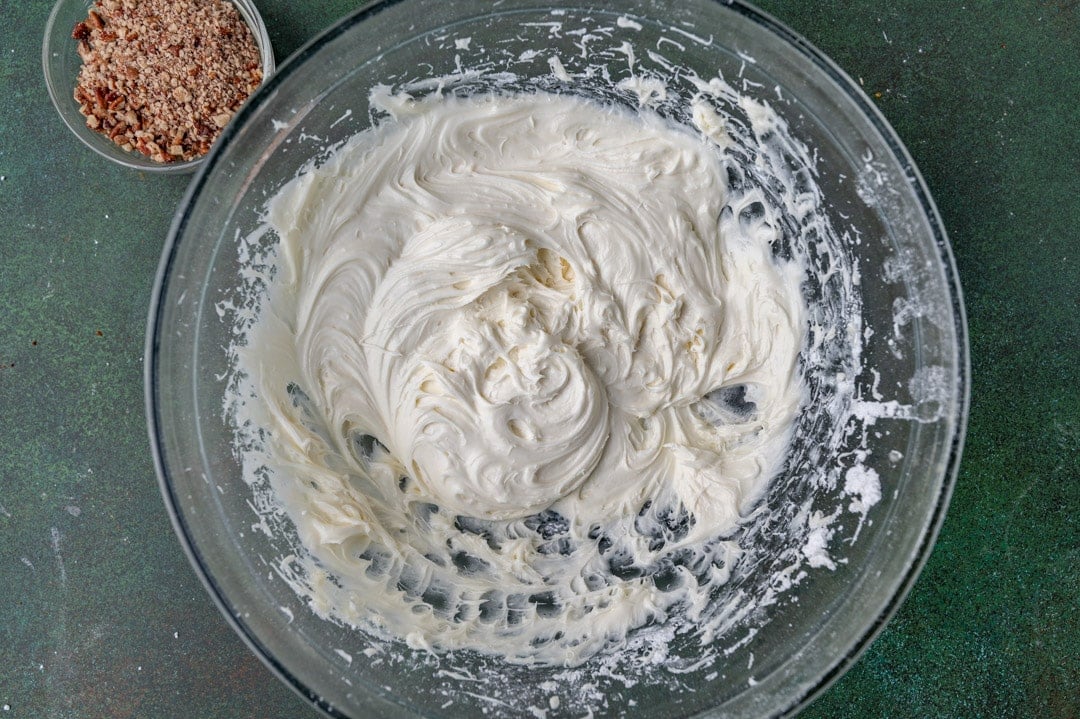 cream cheese frosting in a glass bowl