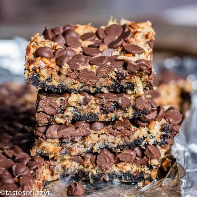 stack of magic cookie bars with an Oreo cookie crust