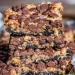 stack of magic cookie bars with an Oreo cookie crust