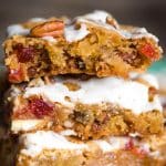 These chewy Fruit Cake Cookie Bars will melt in your mouth. This Christmas dessert with pecans, dried cherries and pineapple has a rum glaze. 