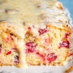 A close up of cranberry orange bread with glaze
