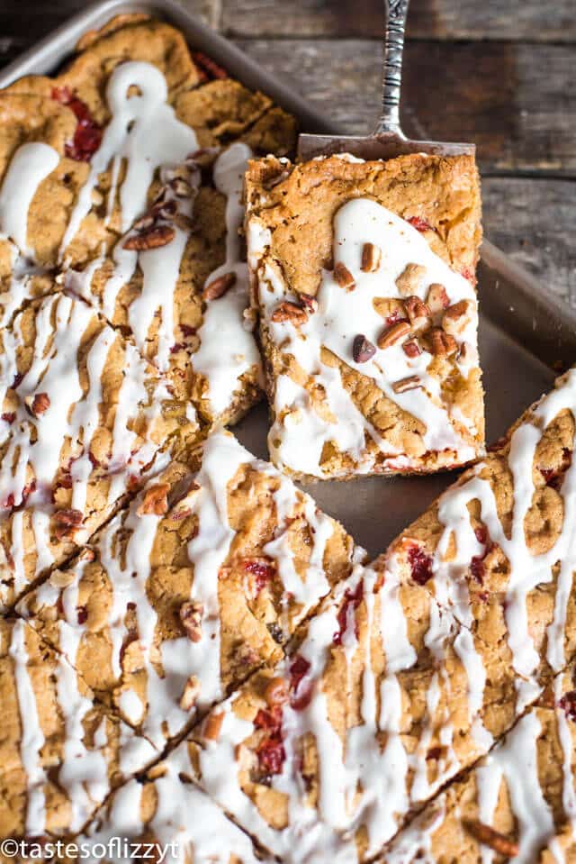 A close up of a glazed cookie bar