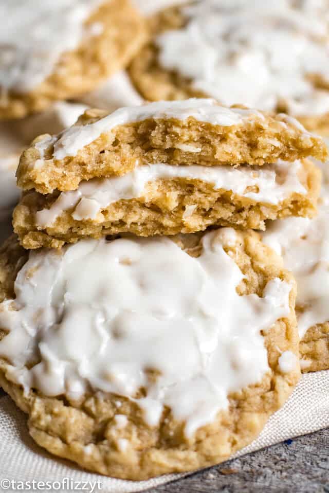 pile of sliced oatmeal cookies with one broken in half