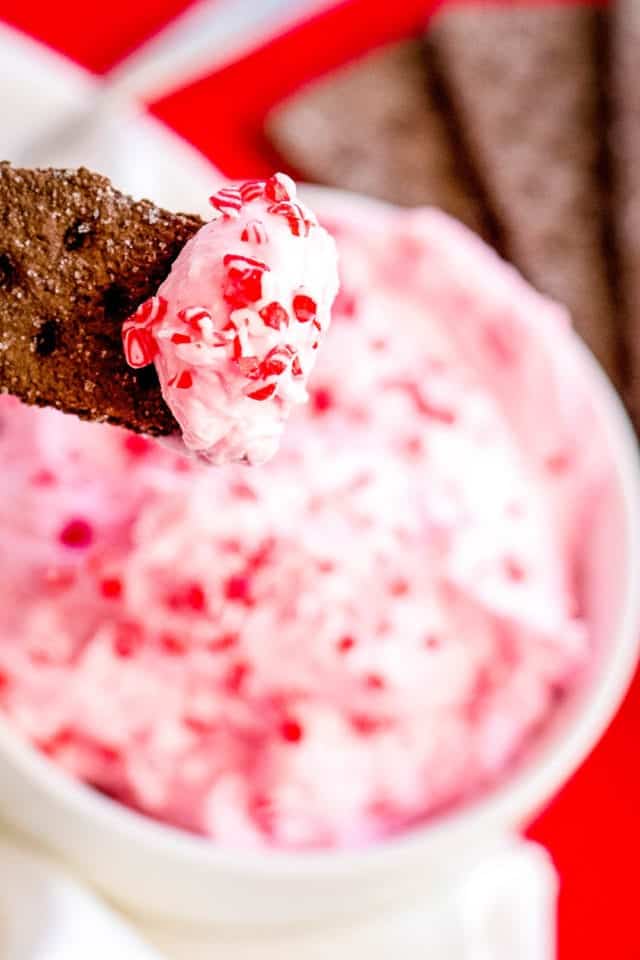 sweet peppermint cream cheese dip on a graham cracker