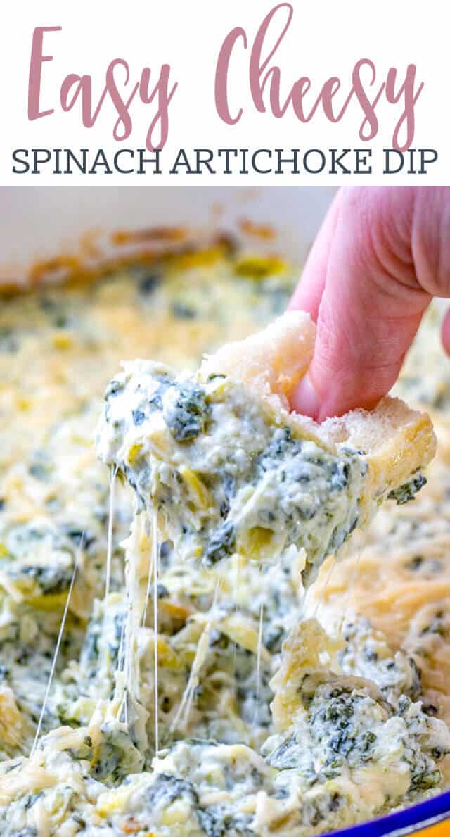 hand holding bread with cheesy spinach dip