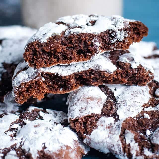 chocolate crinkle cookies broken in half to reveal the inside